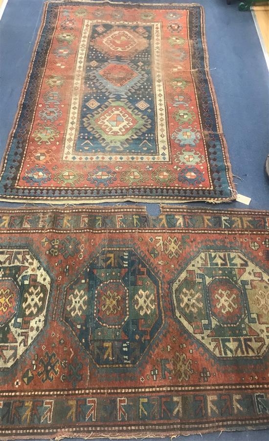 Two Caucasian red and blue ground rugs 210 x 130cm and 175 x 100cm. worn